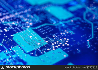 High-tech background. Electronic circuit board. Macro. Selective focus.