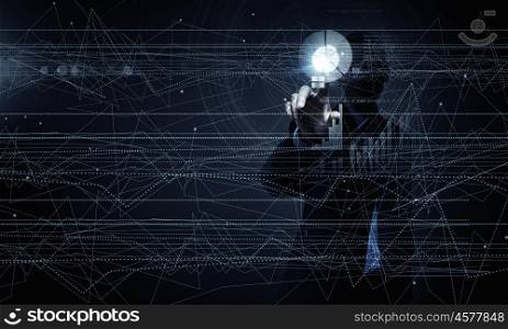 High technologies. Young businessman pressing high tech circle icon on media screen