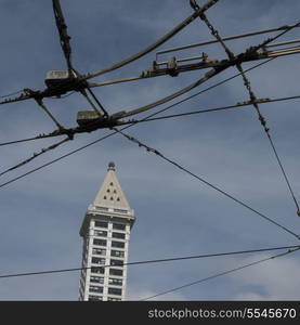 High-tension wires in front of a tower, Smith Tower, Pioneer Square, Seattle, Washington State, USA