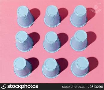 high view blue plastic cups with shadows