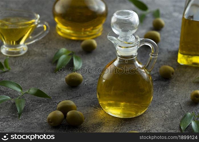 High view of bottles filled with olive oil on marble background Picture on pik. Resolution and high quality beautiful photo. High view of bottles filled with olive oil on marble background Picture on pik. High quality beautiful photo concept