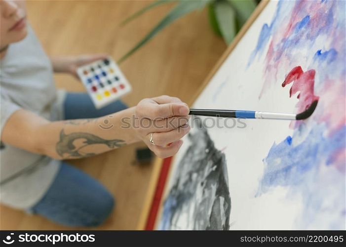 high view person creating painting