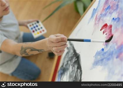 high view person creating painting