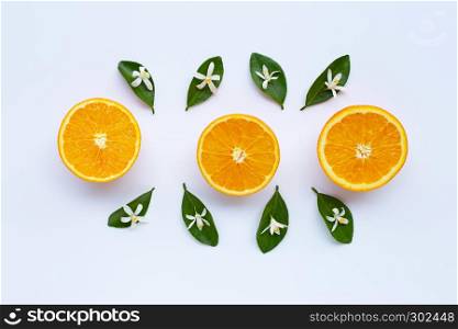 High vitamin C. Fresh orange citrus fruit with leaves and flower on white background.