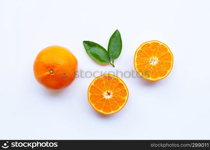 High vitamin C. Fresh orange citrus fruit with leaves isolated on white background.