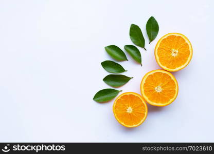 High vitamin C. Fresh orange citrus fruit with leaves isolated on white background. Copy space