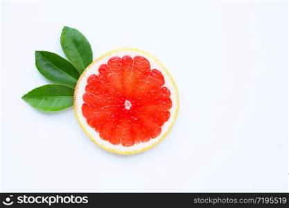 High vitamin C. Juicy grapefruit slices with leaves on white background.