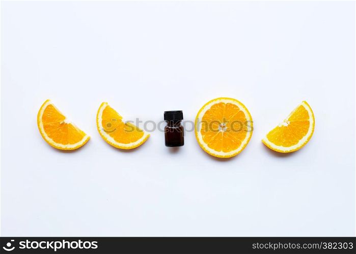High vitamin C, Orange fruits with essential oil bottle on white background
