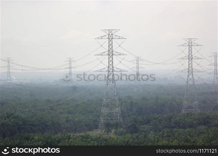 high voltage electric tower in foggy area