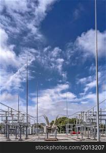 high voltage electrical power substation and blue sky