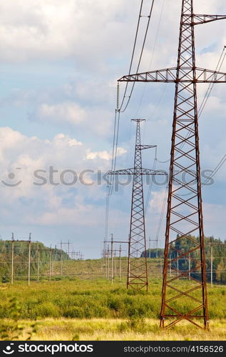 High-voltage line of electricity transmissions on field