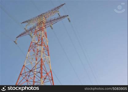 High voltage post and clear blue sky