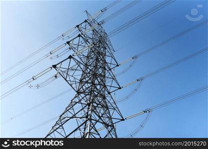 High voltage post, High voltage tower blue sky background, Electricity poles and electric power transmission lines against countryside