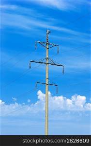 High voltage power pole against the blue sky