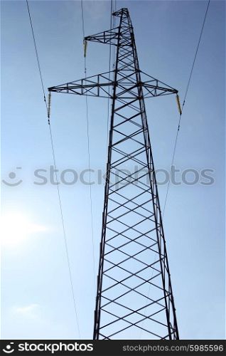 High voltage power pylons against blue sky. High voltage power pylons against blue sky.