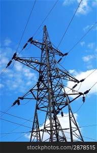 High voltage tower on blue sky background
