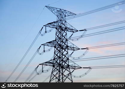 High voltage towers. High voltage power electric transmission towers of a power plant to the substation.