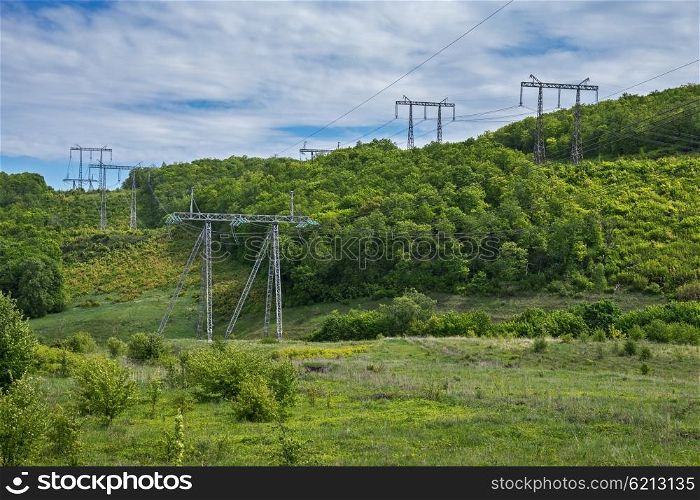 High voltage towers in the forest