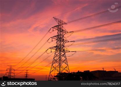 High voltage towers. The electric power industry and infrastructure. The sun is about to fall.