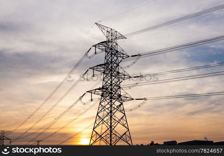 High voltage towers. The electric power industry and infrastructure. The sun is about to fall.