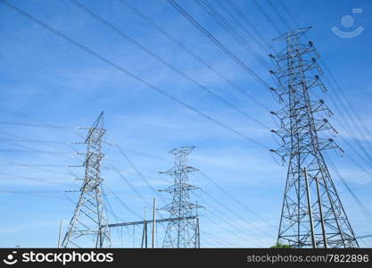 High voltage towers. The meadow below. Industry and nature coexist in appropriate Slightly cloudy sky.And sailed through the air.