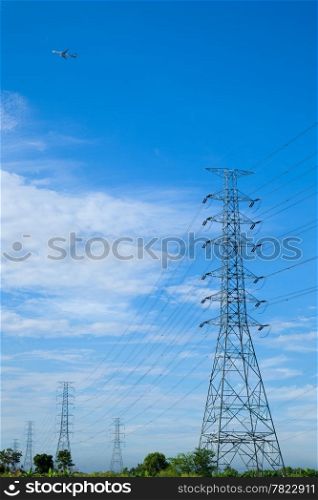 High voltage towers. The meadow below. Industry and nature coexist in appropriate Slightly cloudy sky.And sailed through the air.