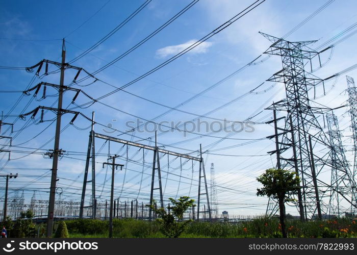 High voltage towers. The meadow below. Industry and nature coexist in appropriate Slightly cloudy sky.And sailed through the air.