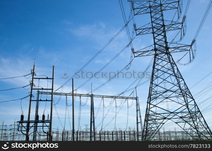 High voltage towers. The meadow below. Industry and nature coexist in appropriate Slightly cloudy sky.And sailed through the air.