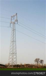High voltage transmission lines with blue sky as background