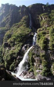 High waterfall and rock in mountain, Nepal