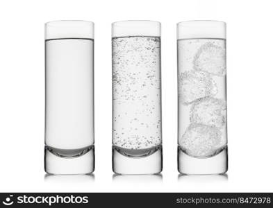 Highball glasses with sparkling and still mineral water with ice cubes on white.
