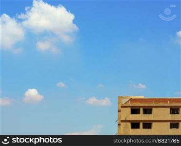 Highest floor of old apartment building with cloud and sky space for text