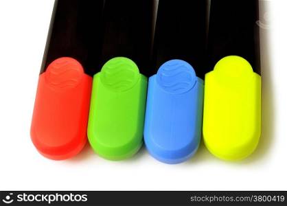 Highlighters blue, green, red and yellow on white background