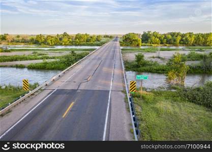 highway and bridge over the South Platte River in Nebraska at Brule, aerial view with summer scenery