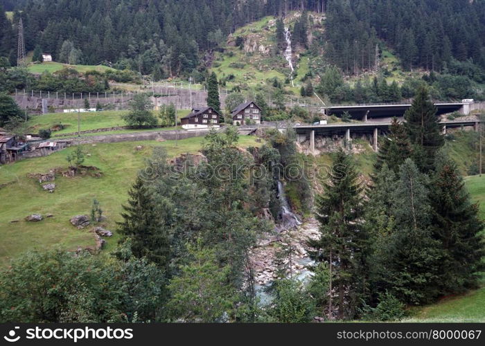 Highway and river in mountain area of Switzerland