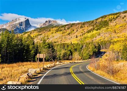 Highway at autumn in Colorado, USA. . Highway at autumn sunny day in Rocky Mountain National Park. Colorado, USA.