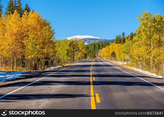 Highway at autumn in Colorado, USA. . Highway at autumn sunny day in Colorado, USA.