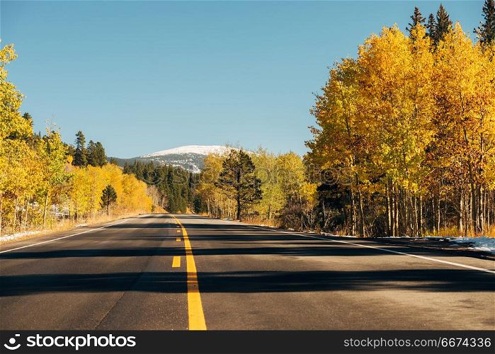 Highway at autumn in Colorado, USA. . Highway at autumn sunny day in Colorado, USA.