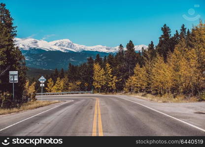 Highway at autumn sunny day in Colorado, USA.