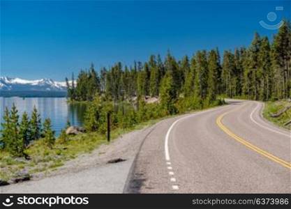 Highway by the lake in Yellowstone National Park, Wyoming, USA
