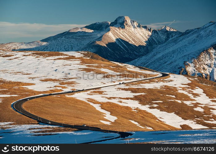 Highway in alpine tundra. Rocky Mountain National Park in Colorado. . Trail Ridge Road, the highest (12,183 feet) continuous highway in the USA in high alpine tundra with rocks and mountains at autumn. Rocky Mountain National Park in Colorado, USA.