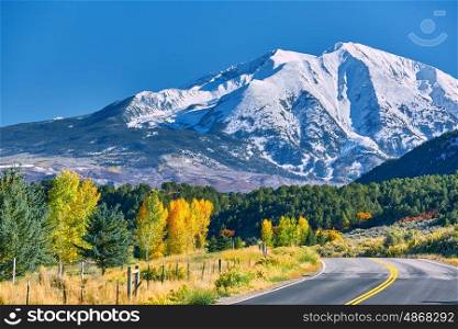 Highway in Colorado at autumn, USA. Mount Sopris landscape.