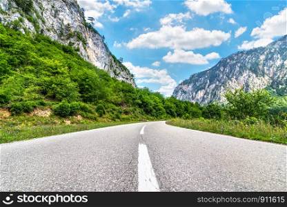 Highway in mountains of Montenegro at sunny summer day. Highway in mountains
