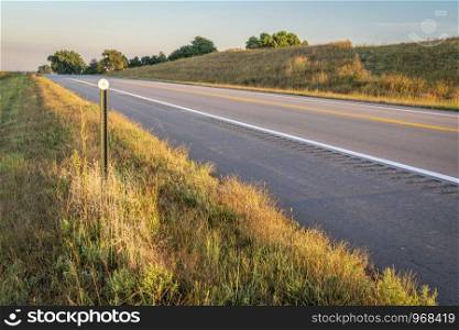 highway in Nebraska Sandhills, late summer or early fall scenery in morning light