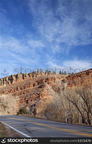 highway in northern Colorado near Fort Collins with redstone cliffs, late fall scenery
