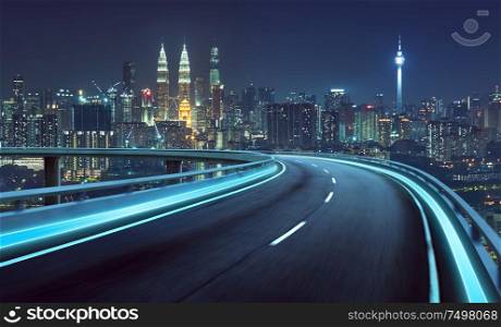 Highway overpass motion blur with city background . night scene .