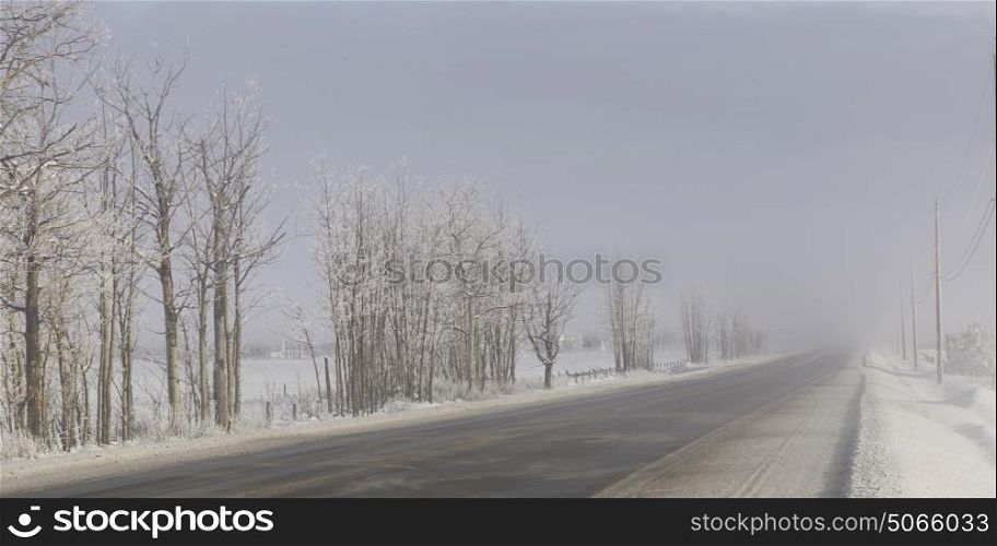Highway passing through snow covered landscape, British Columbia Highway 97, British Columbia, Canada