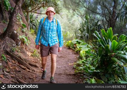 Hike in Hawaii. Hiker on the trail in green jungle, Hawaii, USA