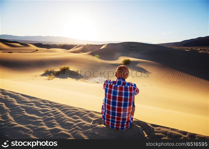 Hike in sand desert. Man in sand desert