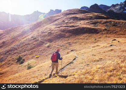 Hike in the autumn mountains. Fall season theme.